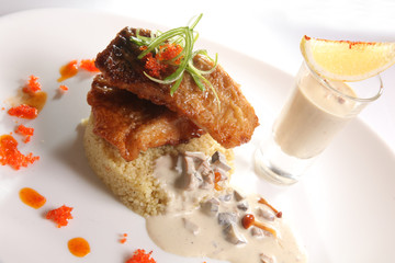 Fried CARP with garnish and mushroom sauce