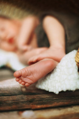 Little white feet of a newborn baby who sleeps