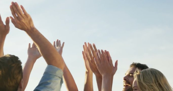 Group of friends doing high five