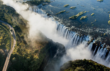 View of the Falls from a height of bird flight. Victoria Falls. Mosi-oa-Tunya National park.Zambiya. and World Heritage Site. Zimbabwe.  - obrazy, fototapety, plakaty