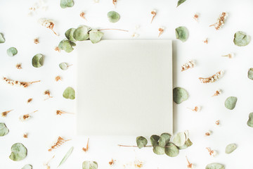 white wedding or family photo album, dry and fresh branches isolated on white background. flat lay,...