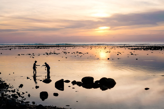 Crab catchers and the colorful beautiful sunset in Phuket. Thail