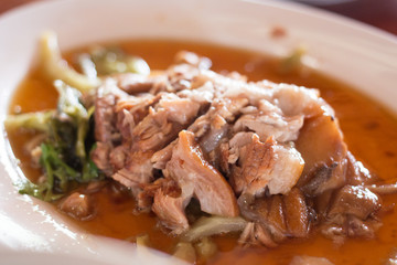 close up stewed pork leg on rice