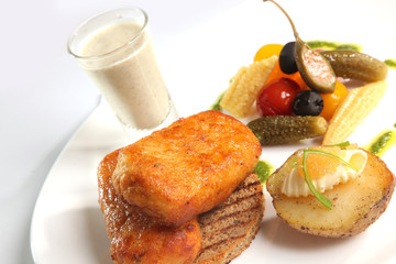 Grilled Pike cutlets with garnish and sauce