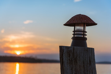 Lamp against beautiful evening sky with sunset. Selective Focus.