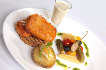 Grilled Pike cutlets with garnish and sauce