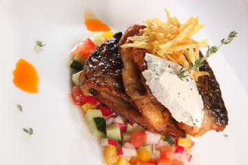 fried fish on vegetables