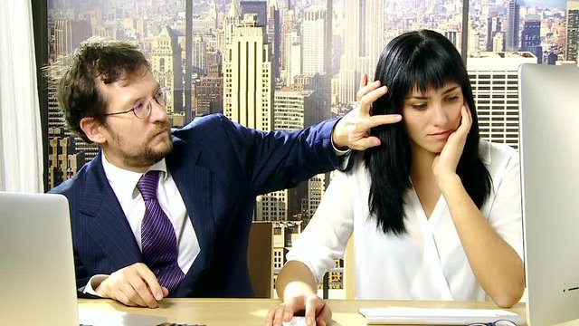 Boss harassing and bothering secretary in office