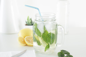 Lemon, mint and ice for a summer mojito beverage it could be with or without alcohol
