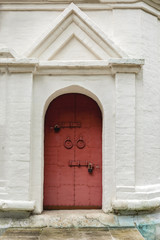 Porch with old door with rings and locks