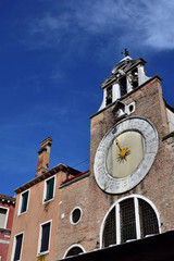 Fototapeta na wymiar San Giacomo di Rialto ancient medieval clock and bell tower, in the market square, the oldest church in Venice