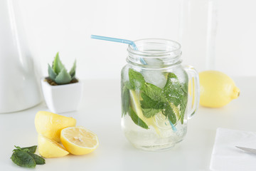 Lemon, mint and ice for a summer mojito beverage it could be with or without alcohol
