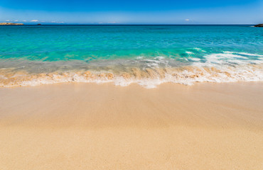 Fototapeta na wymiar Idyllic view to beautiful beach with turquoise blue water