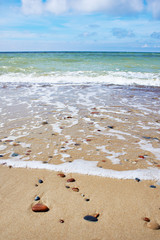 Sea waves on sand beach