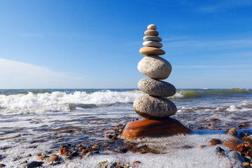 Concept of harmony and balance. Rock Zen near the sea