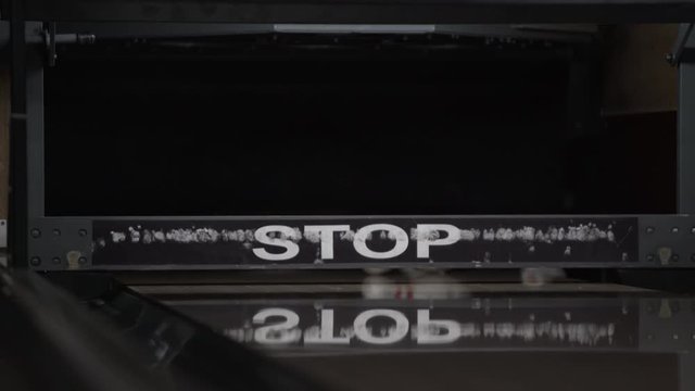 Ball rolls down a bowling lane to a strike