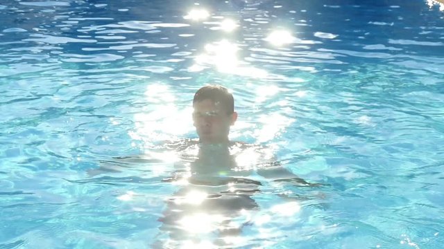 young man dives into a the pool, Slow Motion