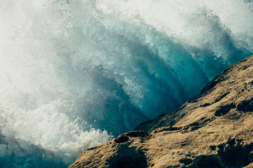 Wave crashing against rock