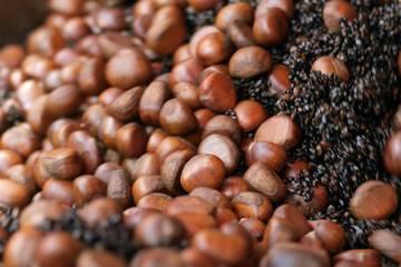 Chestnuts / View of roasting chestnuts inside pan. Chestnut snacks are famous and popular in Yaowarat Road, Bangkok, Thailand.