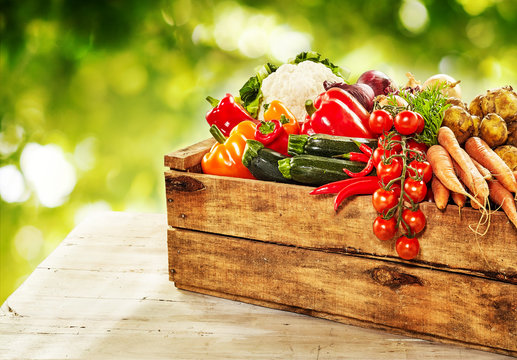 Fototapeta Farm fresh vegetables in a wooden crate