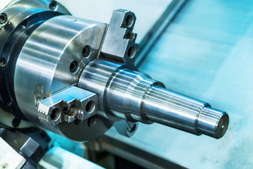 metal workpiece clamped in the lathe chuck CNC machine