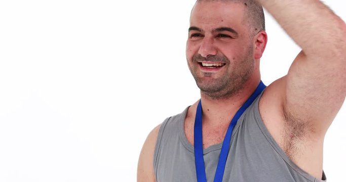 Discus thrower holding medal