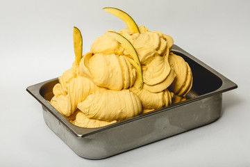 Avocado ice cream in the metal tray on white background