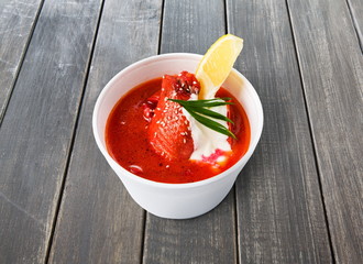Food take away, russian soup borsch on gray wood