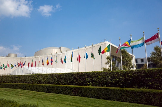 UN United Nations General Assembly Building With World Flags Fly