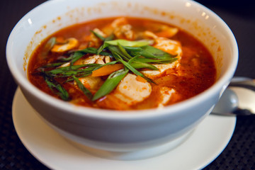 white bowl of red soup