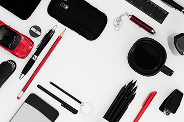 Stylish office workplace in black and red on a white background. Male strict style. Presentation. Frame. Blank notebook. Monochrome.