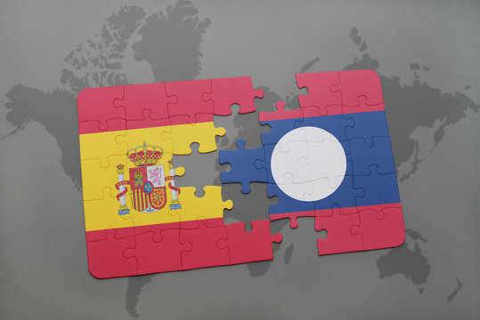 puzzle with the national flag of spain and laos on a world map background.