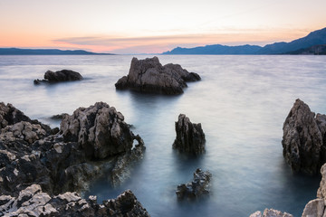 Fototapeta na wymiar sunset over the beach. Croatia, Dalmatia, Makarska Riviera