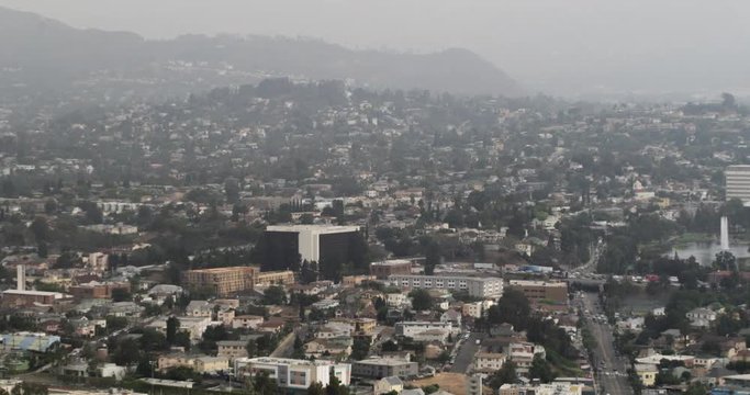 Early morning time lapse looking across Silver Lake from Downtown Los Angeles as low cloud and mist burn away.  Branding and logos removed from clip.