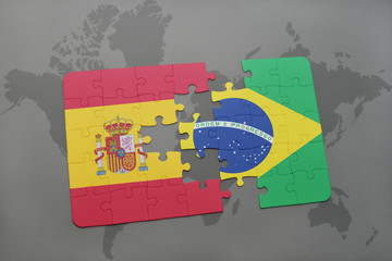 puzzle with the national flag of spain and brazil on a world map background. © luzitanija