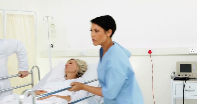 Doctors rushing patient off in an emergency