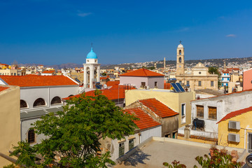 Obraz premium The medieval city with Orthodox cathedral Trimartiry, aerial view from Schiavo Bastion in the sunny morning, Crete, Greece