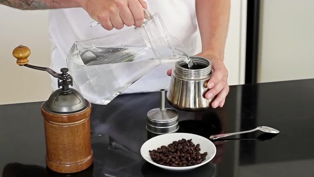 Man prepares coffee beans for cooking