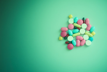 Pharmacy background on a wood table.Pills. Medicine and healthy. Close up of capsules. Different kind of medicines