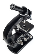 Old microscope isolated on white.