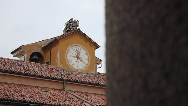 Clock tower with bells at the University of Pavia, PV, Italy, focus shift
