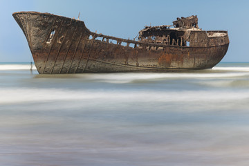 Rusty boat aground on the coast of Morocco