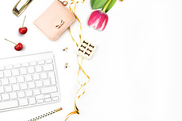 Table view office items, keyboard and flower white background mock-up, woman desk. Office desktop,gold items. Flat lay. Invitation template, gold polka. 