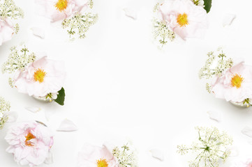 Obraz na płótnie Canvas Flowers on white background. Flat lay. Mock-up desk. Beauty 