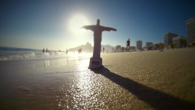 Miniature tourist souvenir standing on Ipanema Beach in Rio de Janeiro, Brazil