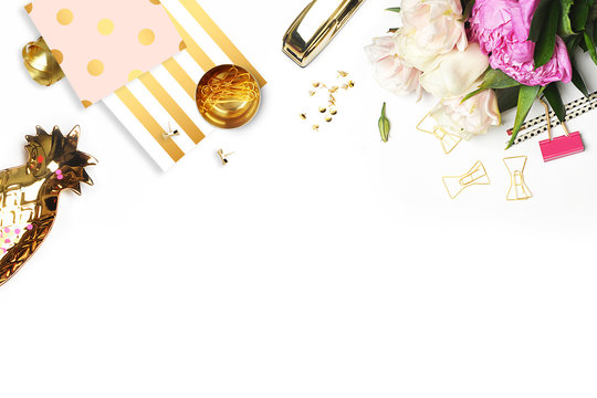 Flat lay. Flower on the table.  Gold pineapple, brush pattern and gold polka dots pattern. Table view. Business accessories. Mock-up background. Peonies, glamour style.