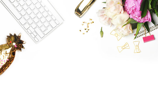 Flat lay. Flower on the table. Keyboard and stapler.  Table view. Business accessories. Mock-up background.Peonies