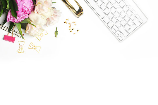 Flat lay. Flower on the table. Keyboard and stapler. Mock-up background.Peonies. Woman background.