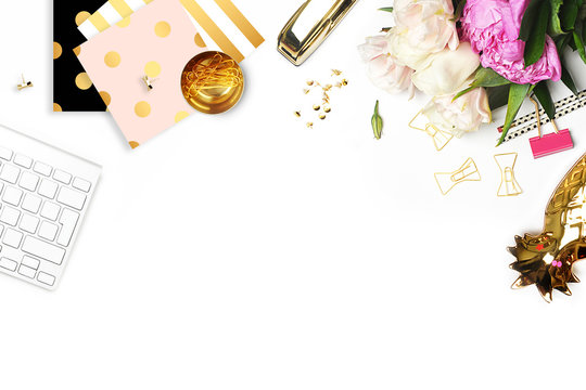 Flat lay. Flower on the table. Keyboard and stapler. Table view. Business accessories. Mock-up background.Peonies