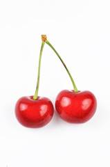 two cherries on a white background
